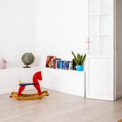 Rocking horse in the corner of a child's room